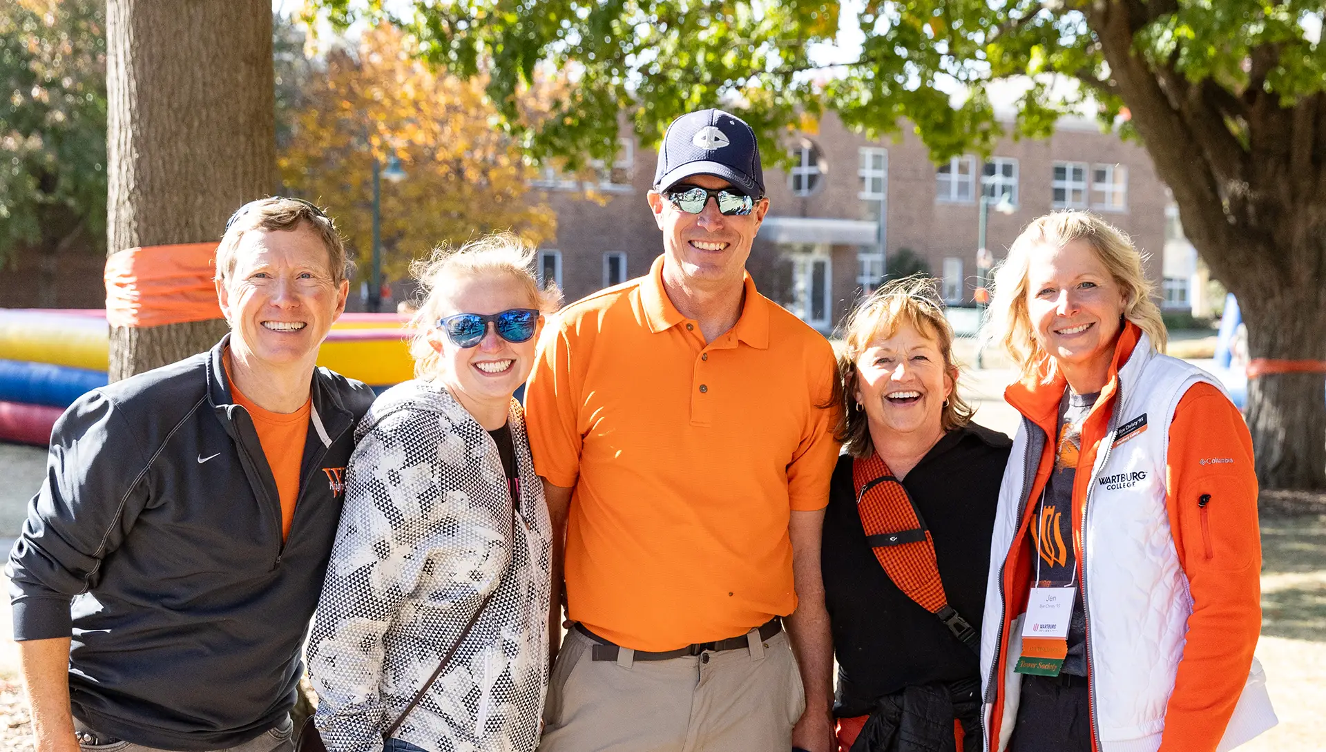 Alumni take a photo during Homecoming